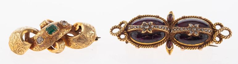 An emerald and diamond brooch, the scrolling panel with engraved foliate motif,