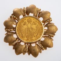 A gold brooch set with an Austrian one Ducat coin, dated 1915,