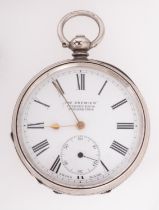 A silver pocket watch the dial having a subsidiary seconds dial and signed for the retailer The