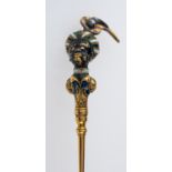 An antique gold and gem set blackamoor pin, with finely detailed feathered turban,