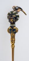 An antique gold and gem set blackamoor pin, with finely detailed feathered turban,