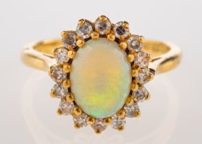 An 18ct gold, opal and diamond ring,