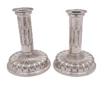 A pair of Victorian silver candlesticks by John Septimus Beresford, London 1886,