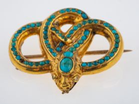 A Victorian style snake brooch set with turquoise, small rose cut diamond set eyes,