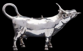 A German silver cow creamer, stamped STERLING, GERMANY and 925, import marked for London 1958,