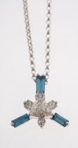 A blue & white diamond pendant set with trilliant cut diamond and three blue baguette diamonds in