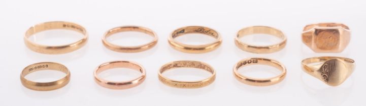 A group of 9ct gold wedding bands, hallmarked and one yellow metal band, gross weight 27.