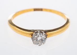 A gold ring set with a single brilliant cut diamond estimated at 0.