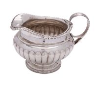 A late George III Scottish silver cream jug by James McKay, Edinburgh 1818,