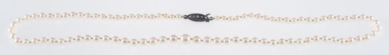 A string of Japanese Cultured pearls by Kitamura, the single sting of pearls set to a silver clasp,