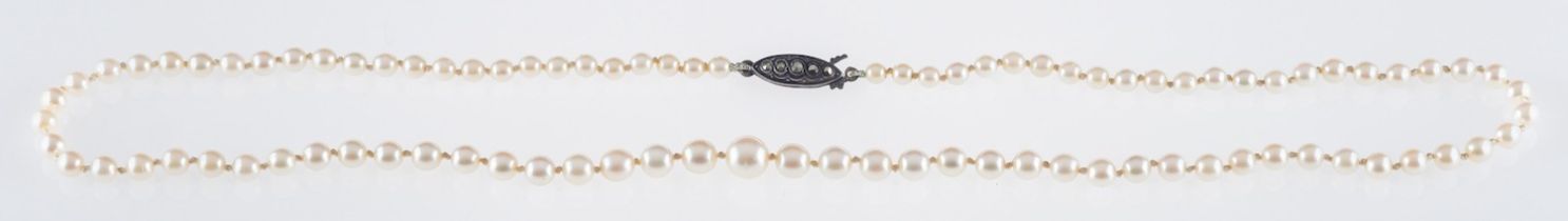 A string of Japanese Cultured pearls by Kitamura, the single sting of pearls set to a silver clasp,