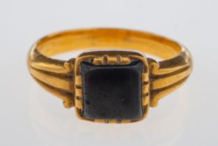 An antique gold signet ring set with black jasper, in hand crafted high carat gold setting,