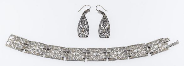 A pair of 1930's paste set drop earrings, 4cm, a similar panel bracelet 19cm,