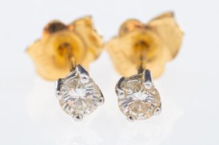 A pair of diamond solitaire earrings, brilliant cut diamonds, total 0.