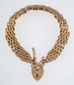 A gold gate link bracelet with heart clasp, 9ct gold length 18cm. weight 24.