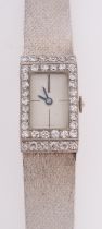 A platinum and 18ct white gold and diamond ladies wrist watch the rectangular dial with baton