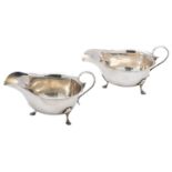 A pair of silver sauce boats by Mappin & Webb, Birmingham 1920, oval with scroll handles,