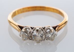 A diamond three stone ring, set with three brilliant cut diamonds, approximately 0.
