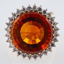 A Vintage Madeira citrine cocktail ring, the central stone of red to orange colour,