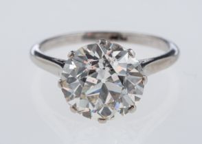 A solitaire diamond ring, the transitional cut stone of around 3.