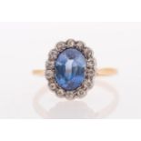 A sapphire & diamond ring, the oval faceted sapphire of good colour measuring 8.5 x 6.