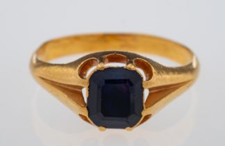 A violet blue sapphire set ring, the faceted stone set in high carat gold,