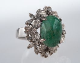A Vintage jade and diamond cocktail ring, central jade cabouchon,