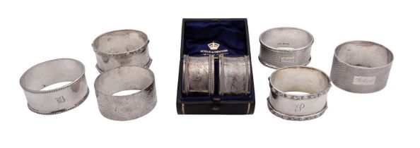 A pair of late Victorian silver circular napkin rings, maker's mark illegible, London 1873,