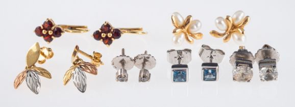 Six pairs of earrings, garnet set and leaf form in 18ct gold, very small diamond studs,