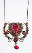 An early 20th Century Scandinavian filigree silver gilt pendant set with heart form and faceted