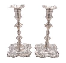 A pair of late George II cast silver candlesticks by John Cafe, London 1753,