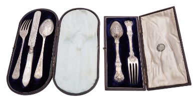 Two Victorian silver christening sets, the three piece by Josiah Williams & Co.