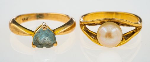 A pearl ring set in 18ct gold and a blue topaz ring unmarked,