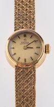 Omega a 9ct gold lady's wristwatch the dial with raised baton numerals and signed Omega Automatic,