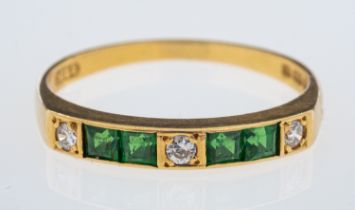 An emerald & diamond ring set with square cut emeralds and brilliant cut diamonds, in 18ct gold,