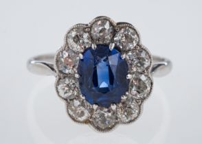 A sapphire & diamond ring, the oval faceted sapphire of around 1.