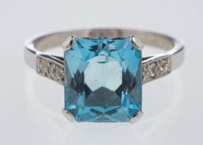 A platinum dress ring set with a mixed cut aquamarine,