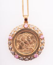 An Elizabeth II half sovereign coin in gold mount with heart form diamond settings and pink