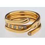 George Jensen a Magic ring combination of a gold band inset with brilliant cut diamonds and a