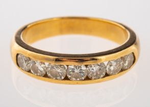 A seven stone diamond ring, set with seven brilliant cut diamonds, approximately 0.
