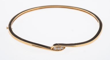 A contemporary gold hinged bangle set with three small diamonds, interior size 5.