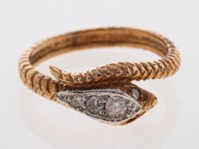 A gold ring in the form of a serpent the head set with diamonds, 18ct,