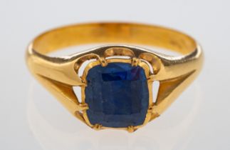 A fine gold ring set with a faceted sapphire of good colour, closed back claw setting, unmarked,