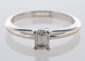 An 18ct gold, rectangular step-cut diamond ring, estimated diamond weight ca. 0.