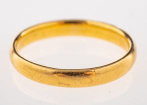 A 22ct gold wedding band, stamped 22 with full London hallmarks, ring size M, 3.