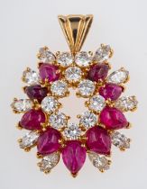 A ruby and diamond set pendant, garland form set with cabouchon rubies,