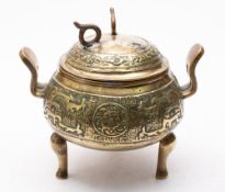 A Chinese brass incense holder and cover