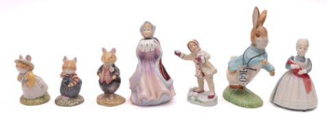 A mixed group of collectible figures, co