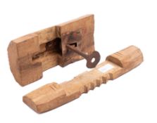 An early wood and iron lock and key with wrought iron plate and wooden bar with five notches, 22.