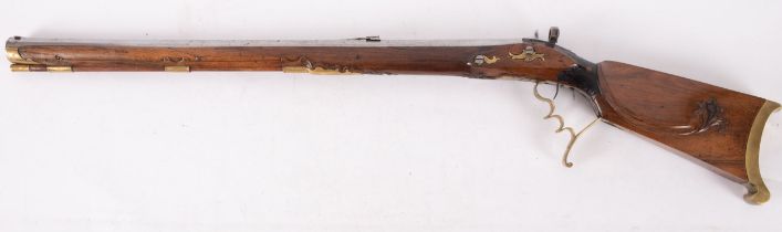 An Austrian percussion cap rifle, the 27 inch octagonal rifled barrel with fore and rear sights,